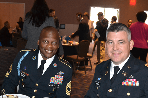 Veterans Day Luncheon-Close up of two active duty members of armed forces